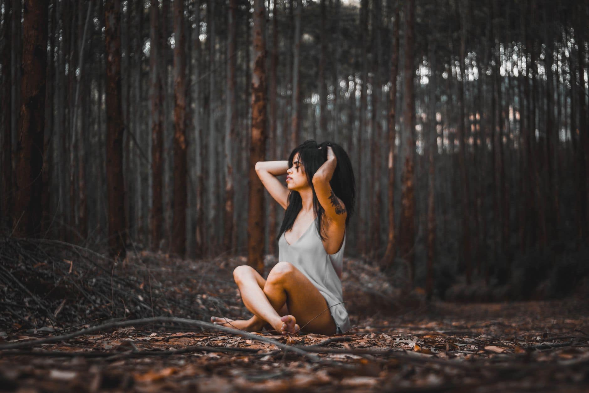 photo of woman sitting on ground
